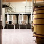 Modern winery with big steel and wooden barrels